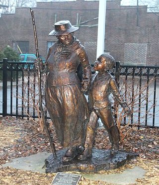 Statue commemorating Harriet Tubman, Ypsilanti District Library, 229 West Michigan Avenue,Ypsilanti, Michigan. The sculptor is Jane DeDecker. The sculpture was installed in 2006 according to the plaque at the foot of the sculpture.